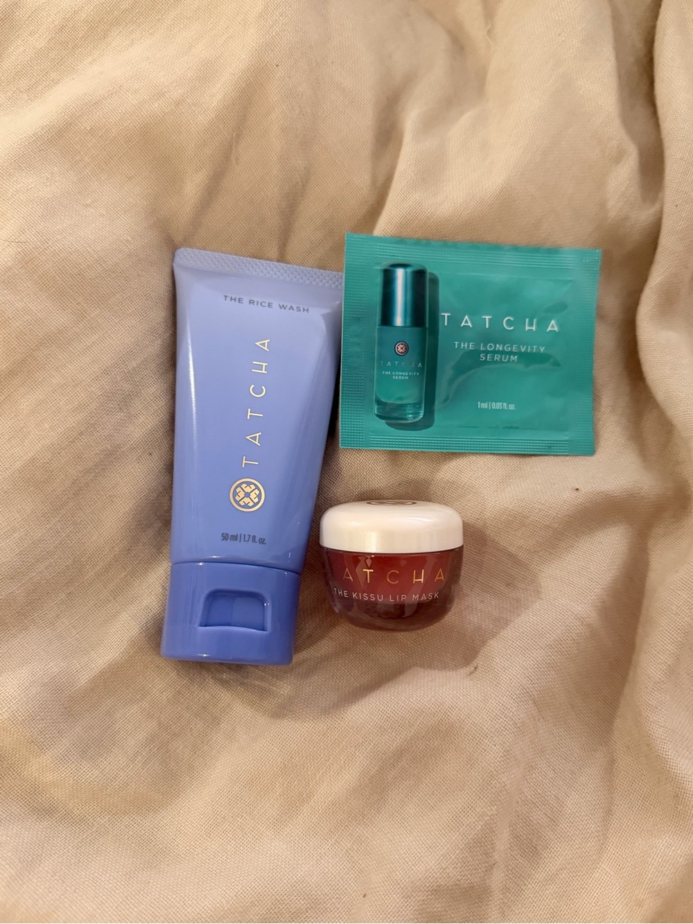 Tatcha skincare trio in lavender, teal & red